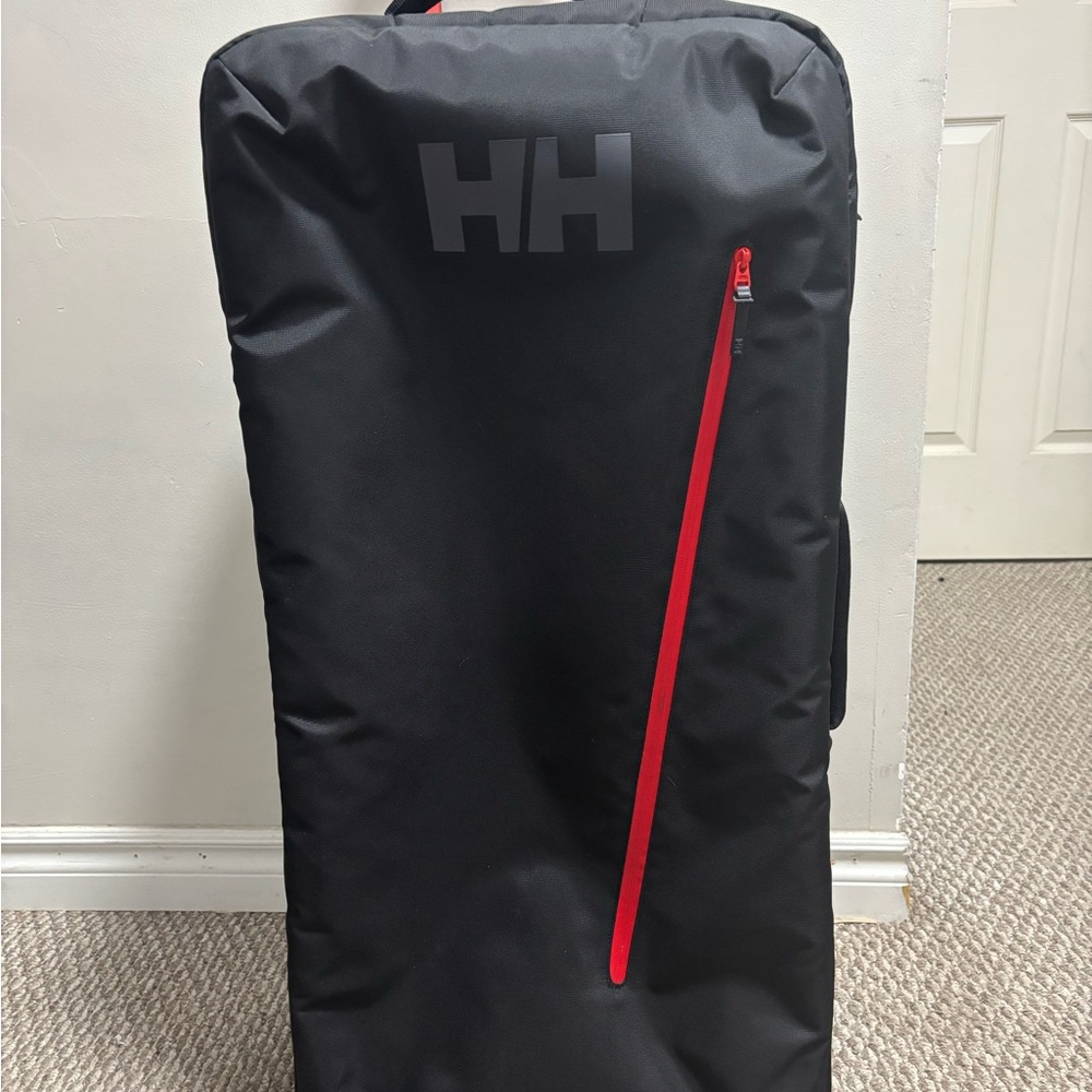 Helly Hansen Black Travel Bag with Red Accents 100L with wheels and handle